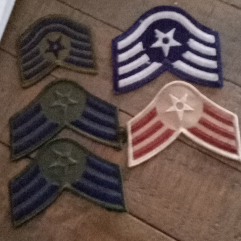 Five United States Air Force Iron On Patches with different rankings